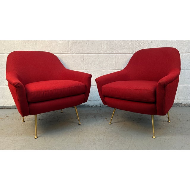 Add warmth and sophistication to your space with this stylish pair of mid-century modern–inspired lounge chairs....