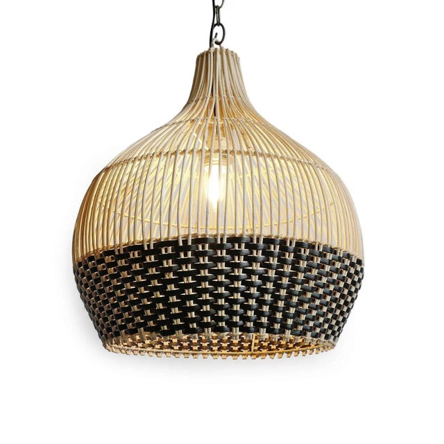 Hand woven pendant light crafted from natural wicker with a striking two-tone weave. The open vertical ribs taper...