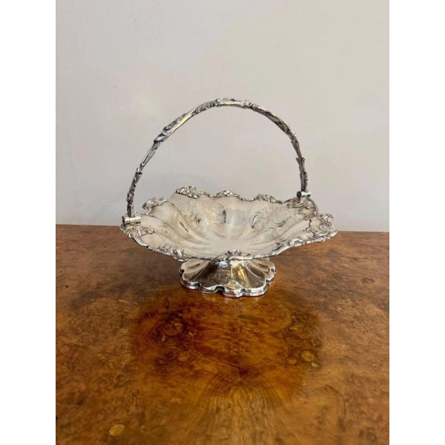 Lovely quality antique Edwardian Silver Plated Cake Basket, having a quality shaped swing handle above a shaped cake...