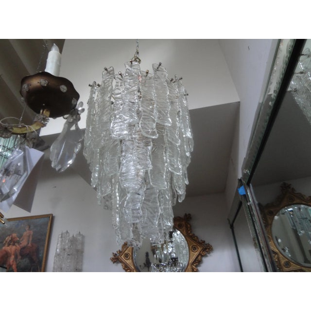 Large midcentury Murano chandelier in the manner of Toni Zuccheri for Venini. Stunning large midcentury clear Murano glass...
