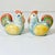 This is a pair of Pottery Studio style ceramic Salt & Pepper Shakers. They are colorful Roosters in a pretty pale colored...