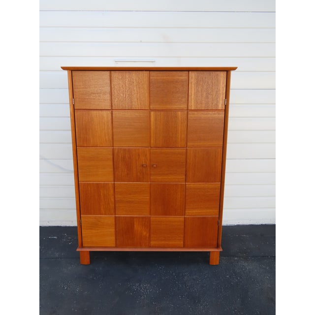 Transform your work-from-home space with this striking vintage Mid-Century Modern hidden office armoire. Combining a...