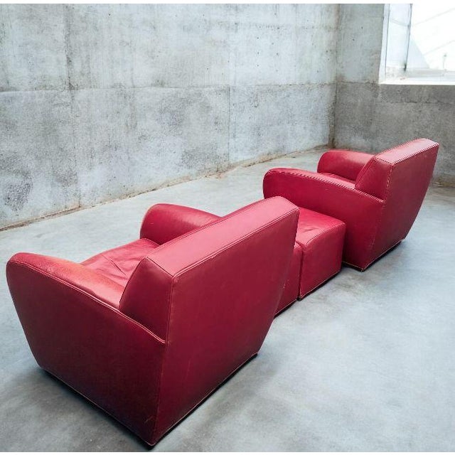 Elevate your space with this stunning pair of vintage Italian leather club chairs with two matching Ottomans by Cabot...