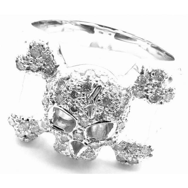 About This Piece: Metal:18k White Gold Measurements: Size: 6 Weight: 14.2 grams Width: 13mm Stones: 50 Round Brilliant cut...