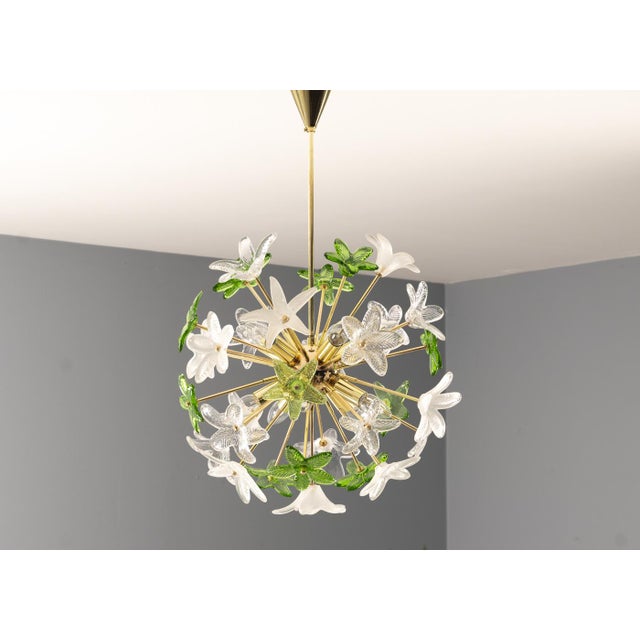 Decorative sculptural chandelier produced in Czechoslovakia during the 1970s–1980s, composed of a brass structure richly...