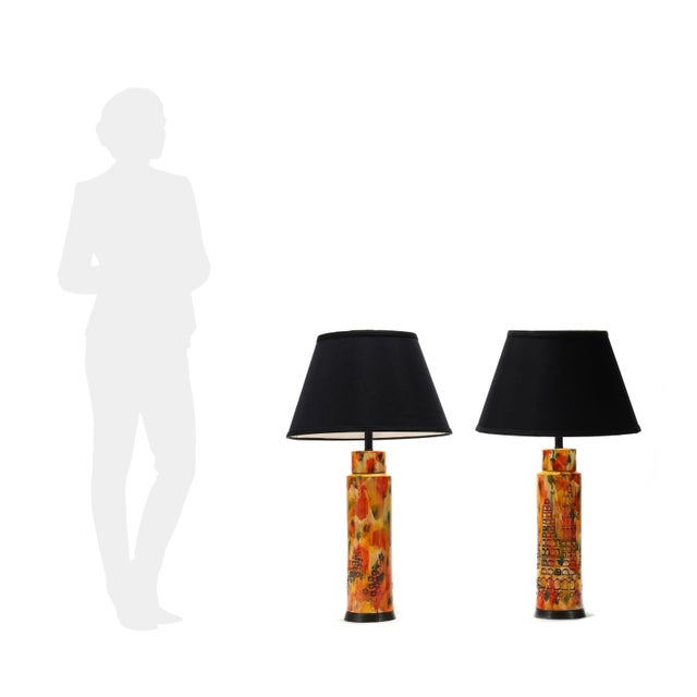 Circa 1970, for Bitossi, appears unsigned, impressed cityscape motifs with yellow, orange, and green splash glaze, single...