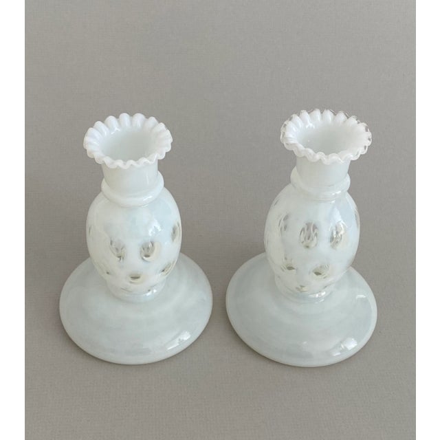 Stunning pair of mid-century French white opaline candle holders with fluted rim and hollow to the base. In perfect...