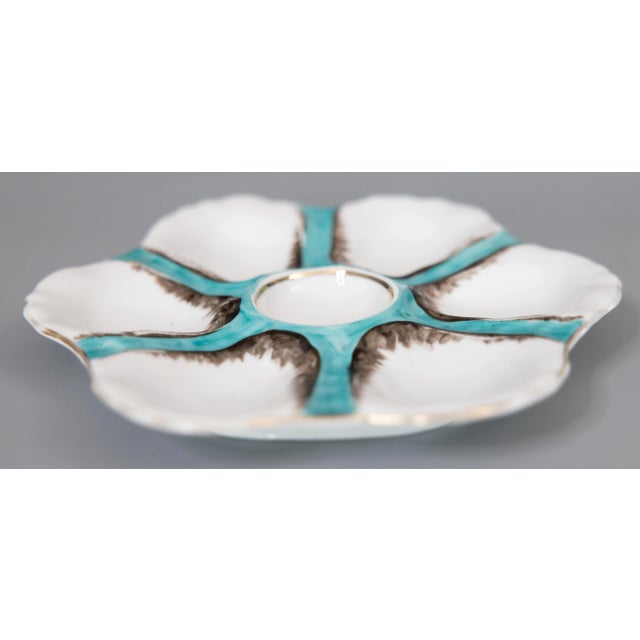 A gorgeous antique French porcelain oyster plate attributed to Limoges, circa 1900. This fine quality oyster plate has six...
