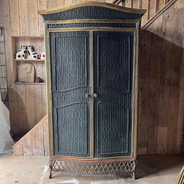 Vintage Teal and Burgundy Wicker Wardrobe The wardrobe has hanging space and 3 removable and adjustable shelves The door...