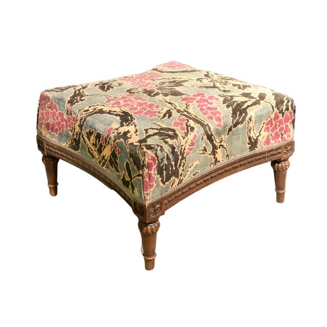 Large antique French Provincial or Louis XVI floral tapestry footstool with carved wooden legs and detailed under-trim....