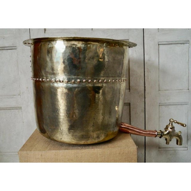 A substantial antique French wine still dating to circa 1880, constructed predominantly from brass with copper rivets and...