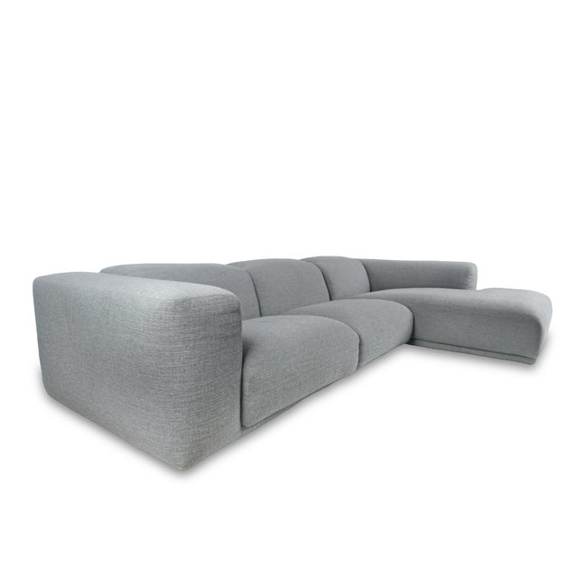 Attributed to The Design Within Reach Kelston Sectional by Matthew Hilton embodies relaxed modernity with sculptural lines...
