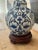 A timeless blue and white porcelain lamp, crafted from a ginger jar form hand painted with a grapevine and leaf motif. The...