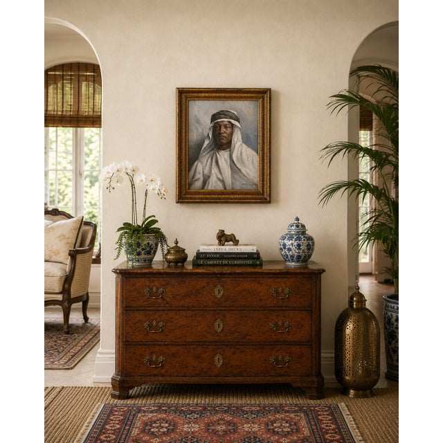 A compelling late 19th-century oil on board portrait depicting a young Middle Eastern sheikh, masterfully rendered with...