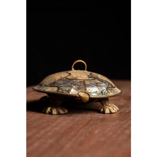 This mid century modern turtles features a handcrafted brass body with brass inlaid iridescent abalone shells, that serve...