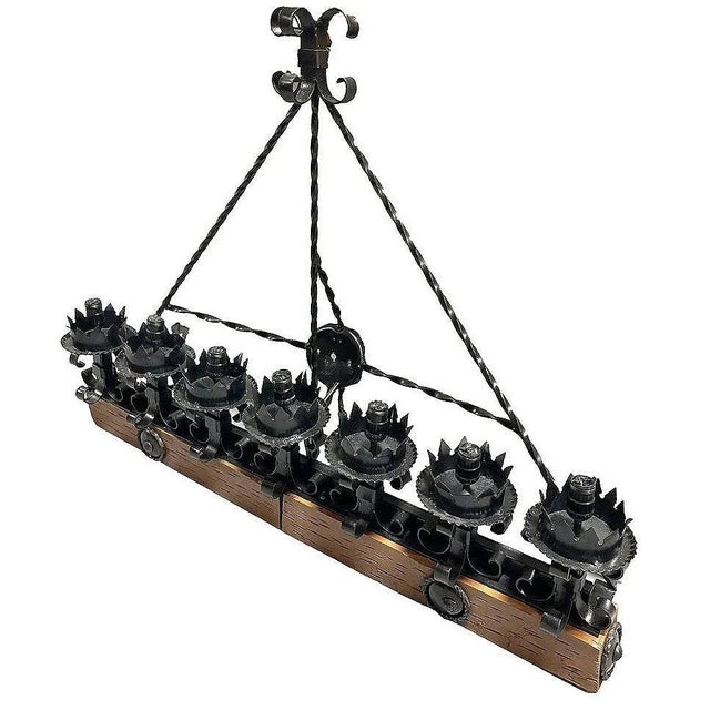 This Spanish Revival/ Medieval revival-style wrought Iron Seven-Light wood beam wall sconce showcases an elegant Fleur de...