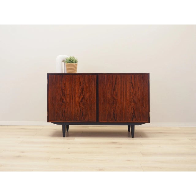 The cabinet was made in the 1970s, produced by the well-known Danish manufactory Omann Jun. Model no. 4. The structure is...