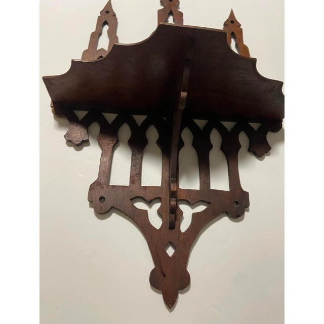 Folk Tramp Art Wall Shelf Made of wood Intricate cute design Steeple like tops Has a very old hairline and repair
