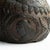 ANTIQUE FOLK ART CARVING An intricately carved coconut with a face on one side which makes use the naturally occurring...