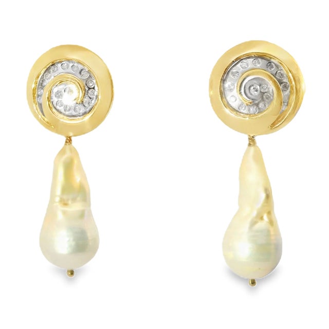 Material: 14K two-tone gold for a versatile and luxurious finish. Gemstones: Baroque white pearls, 1 inch long by 0.5 inch...