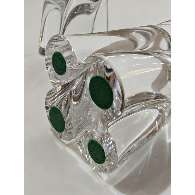 A pair of Baccarat Bambou Tors twisted crystal candlesticks in clear high-lead crystal. Mid-20th century production of a...