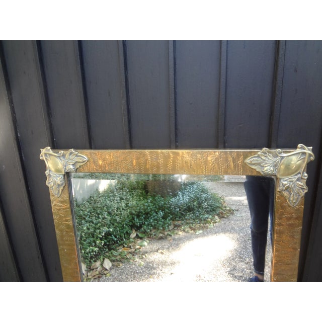 Period French Art Nouveau Brass Beveled Mirror. Stunning antique French Art Nouveau brass hand hammered beveled mirror...