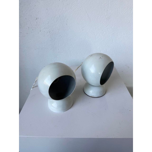 Old small pair of table lamps from the 80s called "eyeball", signed FALCA on one of the bases. The metal is white...