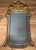 Fine quality large carved and gilt mirror in the English Regency style. Beautiful gilding with a Versailles form interior...