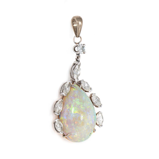 Finely detailed vintage opal & diamond pendant crafted in 14 karat yellow gold (circa 1970s). Cabochon cut opal measures...