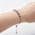 Elegant 14K white gold expandable bracelet featuring brilliant round diamonds and blue sapphires totaling 1 carat. Estate...