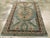 An antique Persian Kurdish Bidjar rug. An enormous serrated straw octagon and two vertical similar half octagons dominate...