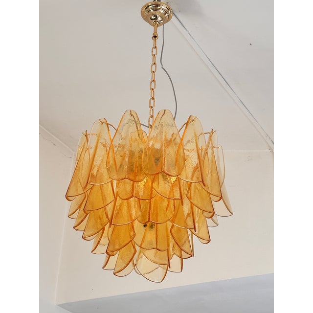 Scenographic and luxury Murano glass chandelier. “Rondini” are traditional elements in Murano glass, poured over a mold...