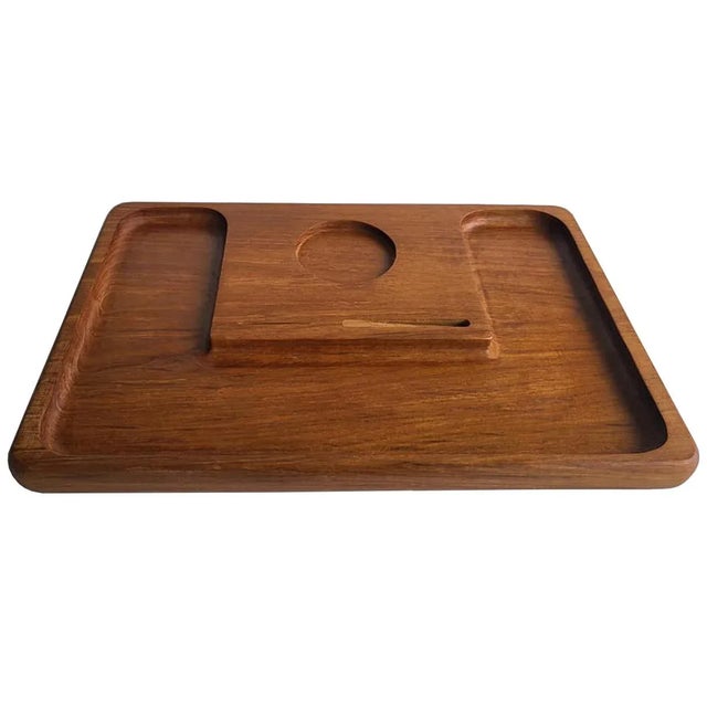 Offered is a mid 20th century teak wood partitioned cheese board with inserts for a cheese knife and a dip bowl or glass....