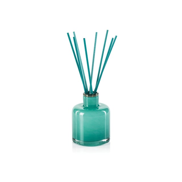 Our sophisticated Bottled Reed Diffuser adds a fragrant and comforting aroma to your favorite space! Glass vessel donned...