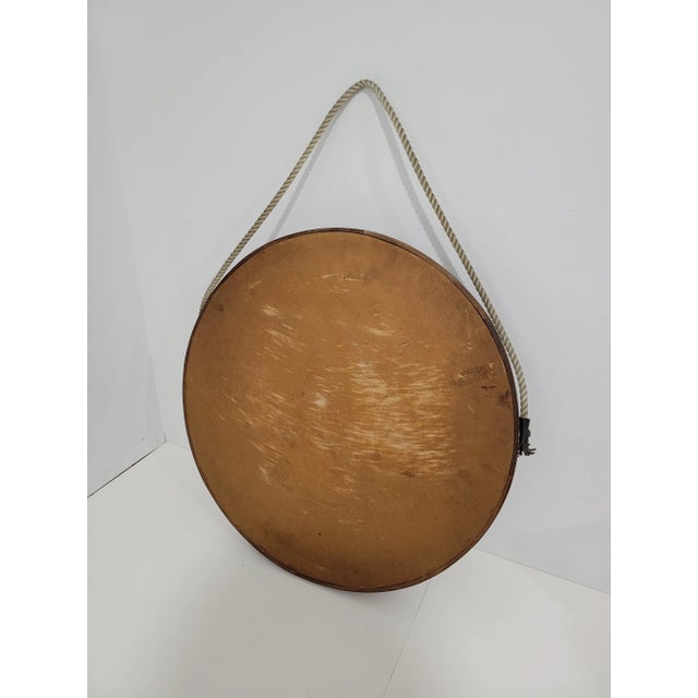 Vintage Danish Modern Style teak wall mirror. Rich tone to teak, and beautiful joinery details. Features a thick rope with...
