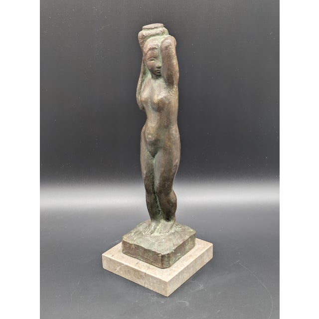Traveling Man Treasures is selling this mid-century modernist bronze full-body statue of a neoclassical nude woman...