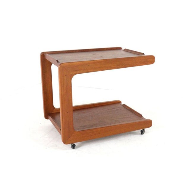 This beautiful mid-century modern tea trolley exudes timeless elegance. Crafted from warm teak wood, this model stands out...