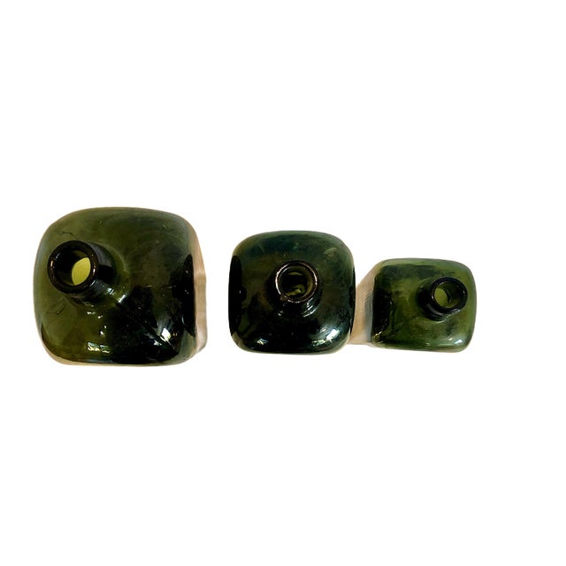 On offer is a three-piece set of "case gin" bottles dating from the mid-to-late 19th century. This iconic square,...