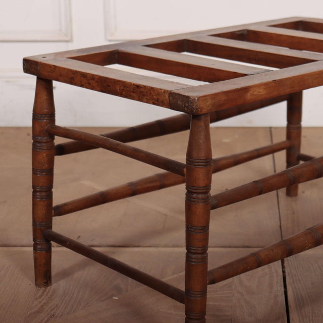Late 19th C beech luggage stand. 1890 This piece is designed in the style of the selected designer and/or manufacturer