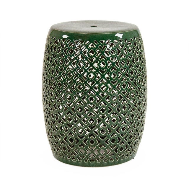 The Lorin Garden Stool is a ceramic garden stool with a barrel form and a geometric diamond pierced pattern in a high-...