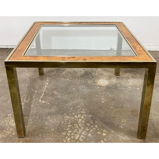 Substantial MCM square side table framed in brass with burled wood inset to top, and a sheet of glass to top. Brass frame...