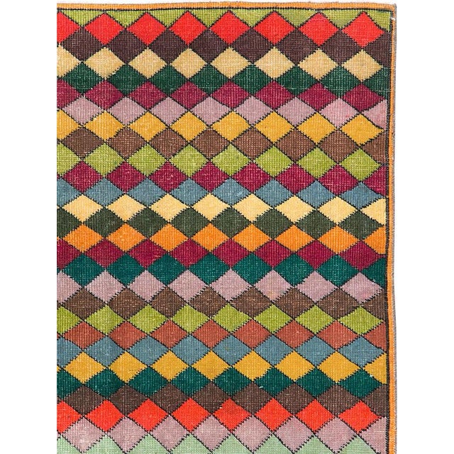 This mid-20th-century Turkish Anatolian accent rug presents a lively allover arrangement of interlocking diamonds...
