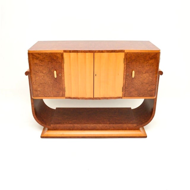 A gorgeous original Art Deco burr walnut and sycamore sideboard, made in England and dating from the 1930’s. This is of...