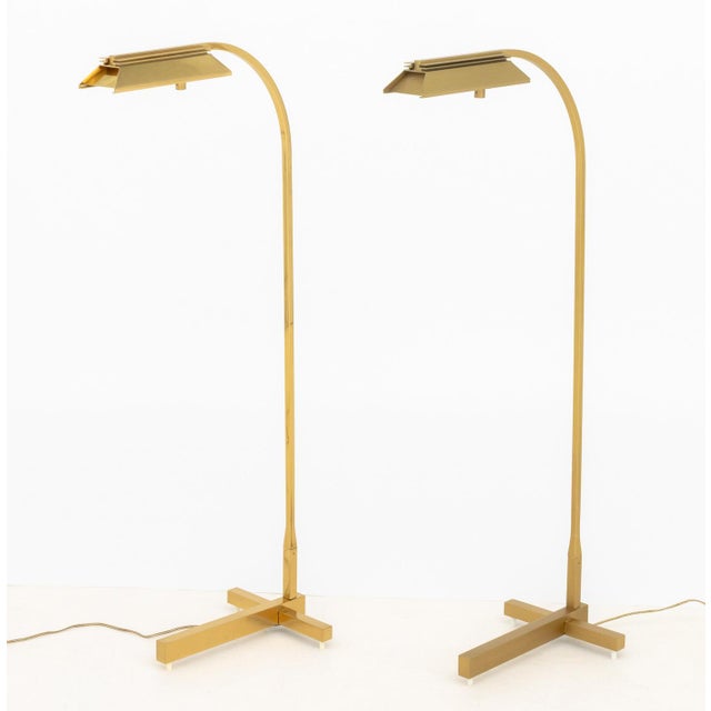 Pair of Casella Lighting Brass Adjustable Floor Lamps, one polished brass and one brushed brass, labels to undersides. 43"...