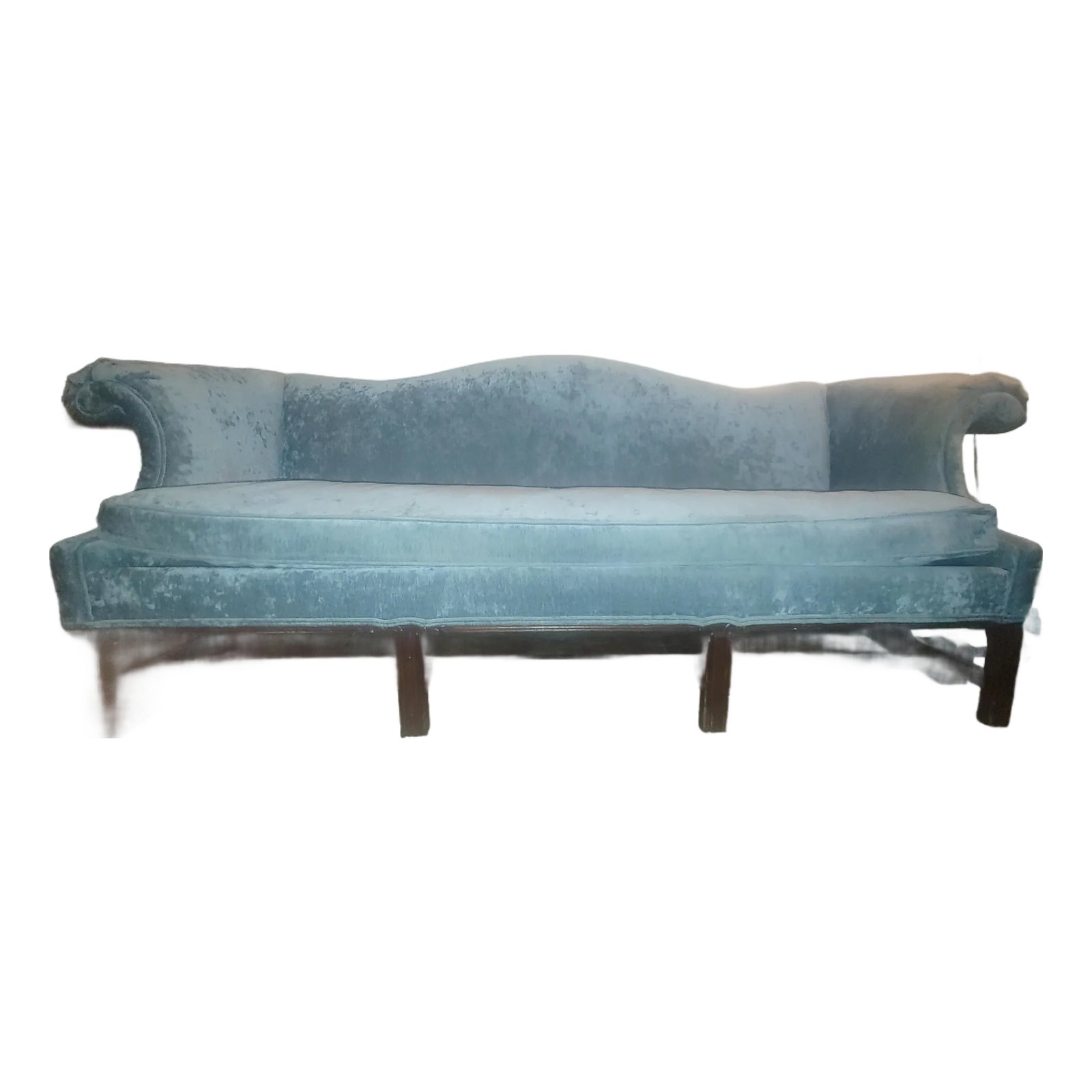 Blue velvet sofa with mid-century legs