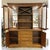 Crafted in a traditional style, this oak case piece features a gently curved front, crown molding, and paneled cabinet...