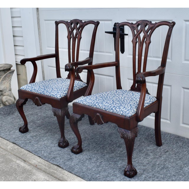 Antique (1910's) Pair of Dining Chairs have a Chippendale Style. The Frames are Wood. Mahogany with a Ball & Claw Foot and...