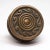 This concentric passage bronze door knob was in the 1900 catalog. The manufacturer is unknown. It is part of the M-11900...