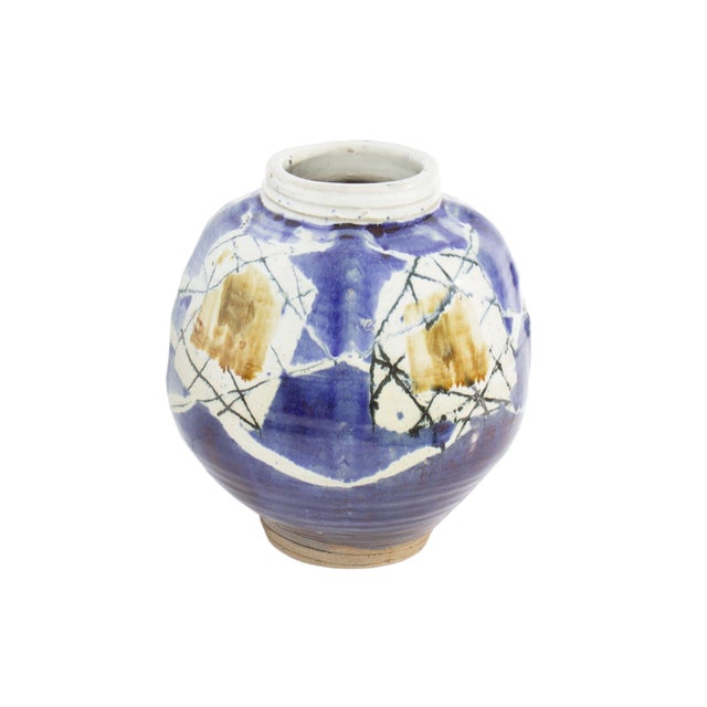 A 1979 studio pottery vase by American ceramic artist Alan Bennett (born 1954). This stoneware vase features a blue glaze...