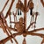 A spectacular and highly decorative Chinoiserie-style chandelier featuring an elaborate faux bamboo framework with a...